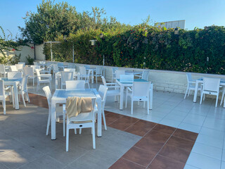 Tables and chairs on the street in a bar, a summer cafe in a hotel on vacation in a heavenly warm eastern tropical country resort