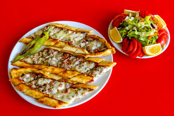 Kiymali pide. Turkish pide with minced meat. Turkish pizza mince pita Pide on white background. Etli ekmek. Kusbasili pide.