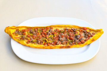Kiymali pide. Turkish pide with minced meat. Turkish pizza mince pita Pide on white background. Etli ekmek. Kusbasili pide.