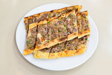 Kiymali pide. Turkish pide with minced meat. Turkish pizza mince pita Pide on white background. Etli ekmek. Kusbasili pide.