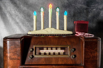 full size antique radio with old fashion electric Christmas candles and candy canes