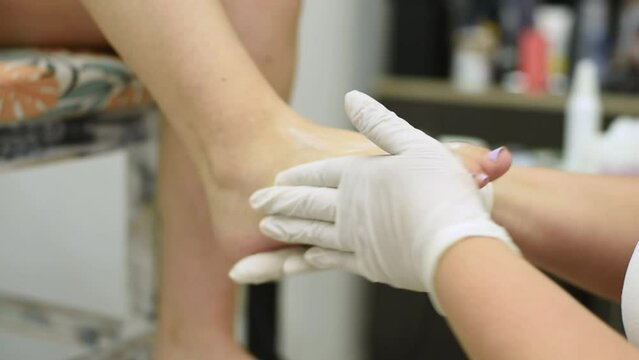 Complete treatment of pedicure and podiatry for health, aesthetics and beauty of the feet and nails in an aesthetic center with a scalpel, file and creams