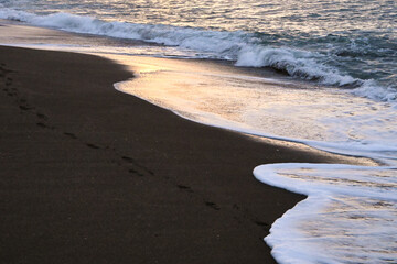 Sea Waves Breaking On A Sandy Beach