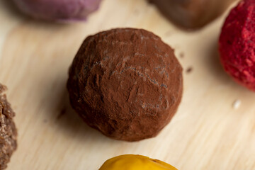 Chocolate sweet candy in the shape of a ball on the table