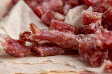 Thinly sliced dried meat sausage