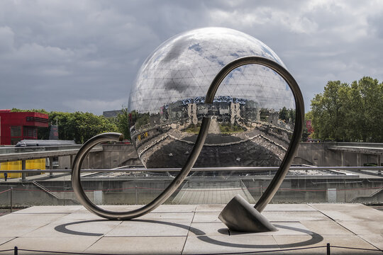 City of Science and Industry (Cite des Sciences et de l'Industrie) - biggest science museum in Parc de la Villette. Mirror-ball building "Geode" - IMAX Theater. Paris, France. AUGUST 17, 2021.
