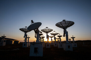 The silhouette of a radio telescope