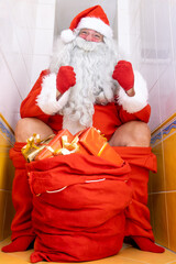 Santa Claus sits on the toilet bowl