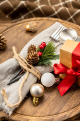 Festive dinner table setting spoon, fork knife, christmas decorations. Christmas concept.