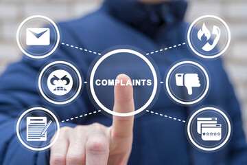 Man using virtual touchscreen clicks word: complaints. Concept of complaints. Customer complaint,...