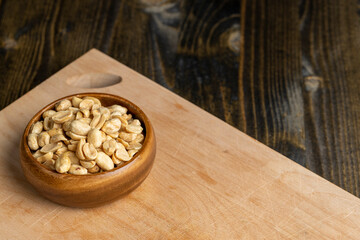 Peeled and roasted peanuts on the table