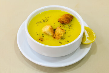 Lentil ( mercimek ) soup with melted butter and red pepper sauce. Mercimek corbasi