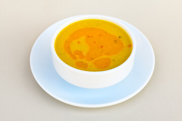 Lentil ( mercimek ) soup with melted butter and red pepper sauce. Mercimek corbasi