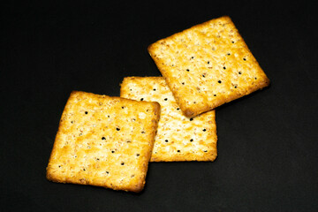 Salt Crackers on a Dark Background