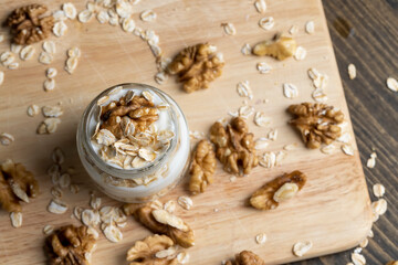 Fototapeta na wymiar Fresh delicious yogurt made from milk with walnuts