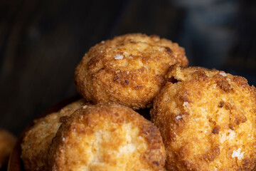 Delicious cookies with coconut on the table