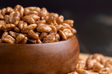 Grain wheat covered with a thin layer of chocolate