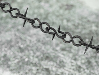 Beautiful black chain with spikes on grey background