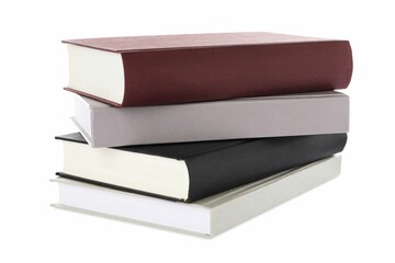 Many different books stacked on white background