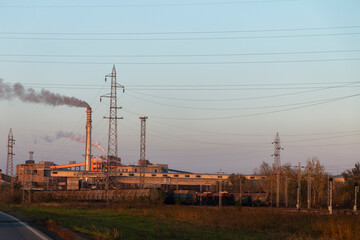 Raw coal drying in a factory. Belts for transport to the thermal power plant. Smoke pollutes the environment.