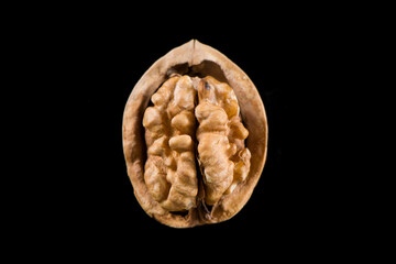 Walnut kernel, Nuts isolated on black background.