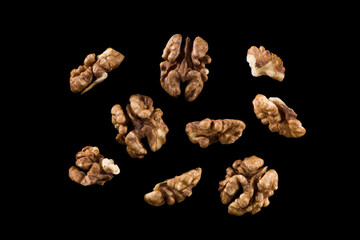 Walnut kernel, Nuts isolated on black background.