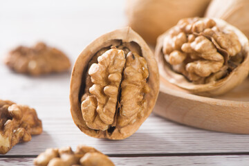 Walnut kernels nut on wooden table.