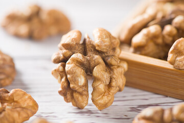 Walnut kernels nut on wooden table.
