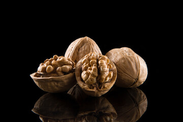Walnut kernel, Nuts isolated on black background.