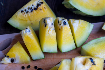 Ripe and juicy yellow watermelon cut into pieces