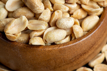 Peeled and roasted peanuts on the table