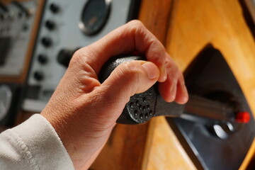 Boat control stick operated for forward power and progress. Control over consumption of energy in the form of fuel.