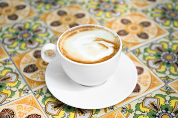 Cup of aromatic coffee on beautiful table