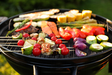 Delicious grilled vegetables on barbecue grill outdoors, closeup