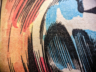 Closeup view of old vintage comic book paper page with abstract line drawings and colorful dot printing pattern