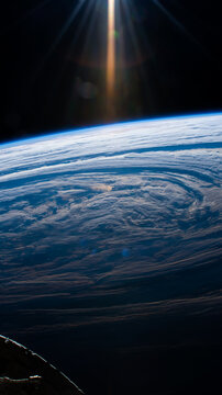 Aerial view of clouds forming on earth's sky as seen from outer space. Digitally enhanced. Elements of this image furnished by NASA.