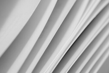 Fototapeta premium Abstract background of the smooth transition of the paper stack.