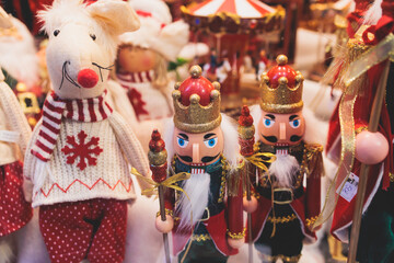 Christmas market details with New Year decorations and multicolored flags, garlands and festoons,...