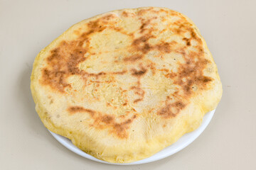 Freshly baked appetizing Turkish tortillas - Gozleme with spinach, cheese  on a wooden board. Space for text. Shallow depth of  field. Handmade Turkish traditional pastries.