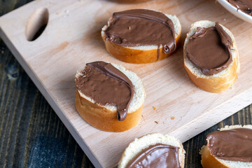 Chocolate butter spread on bread while cooking breakfast