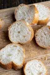 Sliced wheat baguette on a board