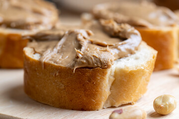Peanut paste on a soft wheat baguette
