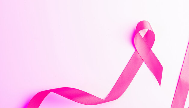 Cancer background. Health care symbol pink ribbon on white background. Breast cancer woman support with copy space.