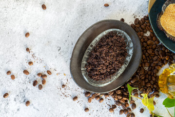 homemade coffee scrub for body made from ground coffee oil sugar and essential oil.