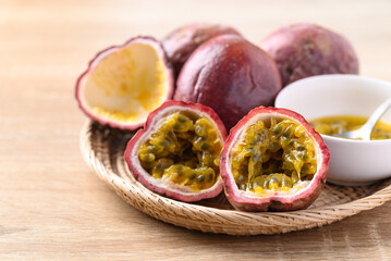 Passion fruit in basket on wooden background, Tropical fruit in summer season