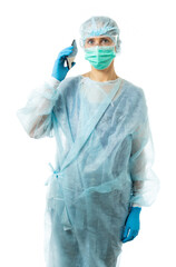 Laboratory Assistant, Doctor. A medic in protective medical clothing, in a disposable medical gown, mask, glasses, gloves, hat, holds a phone, dials a number, answers a call. portrait. isolated