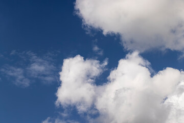 Clouds floating across the sky in the daytime