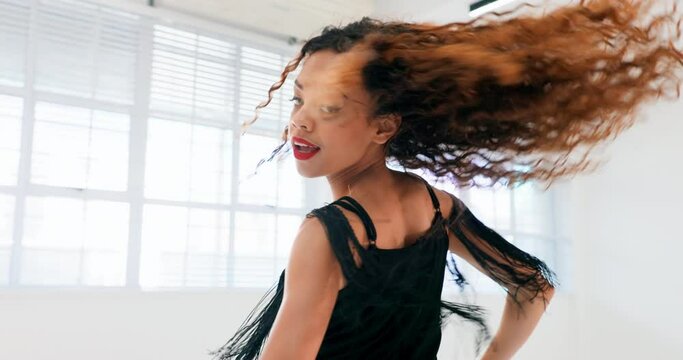 Dance, music and salsa with a black woman in studio for performance training or rehearsal for a show. Fitness, energy and creative with a female dancer dancing alone for expression, fun or freedom