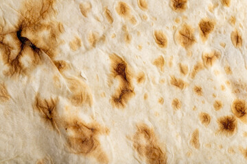 Wheat pita bread with dark spots