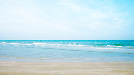 Scene of HuaHin beach with small wave and blue sky background. 
